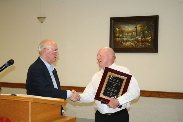 Ron Bockenkamp presented Presiding Commissioner Dr. David Cramp with the Ray Black Award and a plaque for serving the county since 2009 at the annual Truman Dinner.